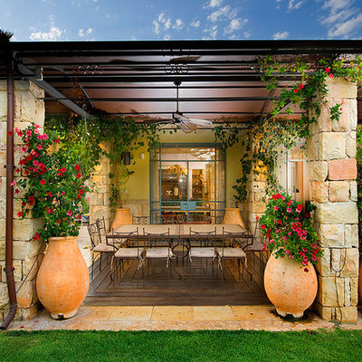 Tuscan patio photo in Other with a gazebo