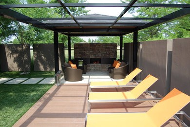 Patio - contemporary patio idea in Toronto with a fire pit and a pergola