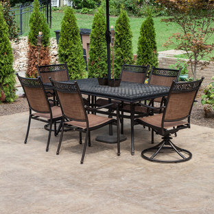 Photo of a medium sized classic back patio in Nashville with stamped concrete and no cover.