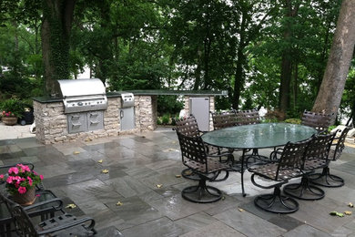 Large transitional backyard stamped concrete patio kitchen photo in Columbus with no cover