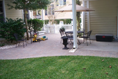 Patio - mid-sized backyard brick patio idea in Charleston with no cover