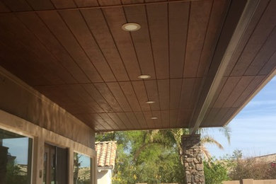 Inspiration for a mid-sized transitional backyard brick patio remodel in Phoenix with a roof extension