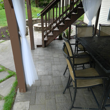 Patio under deck with separate firepit patio.