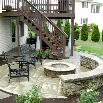 Patio under deck with separate firepit patio.