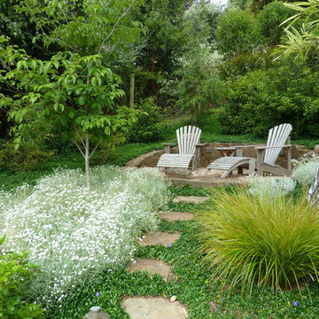 patio with Adirondack chairs and flagstone path