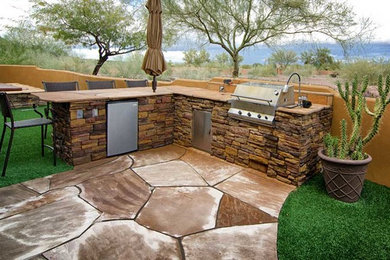 Example of a beach style patio design in Phoenix
