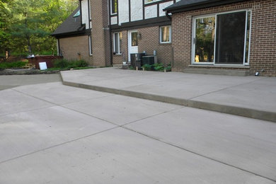 Inspiration for a back patio in Chicago with concrete paving.