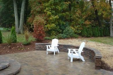 Inspiration for a timeless backyard brick patio remodel in Bridgeport with no cover