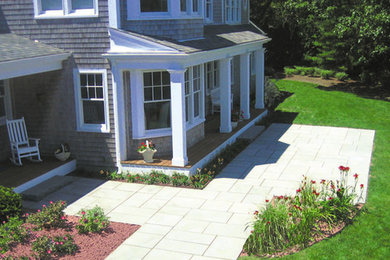 Inspiration for a contemporary front yard concrete paver patio remodel in Providence with no cover