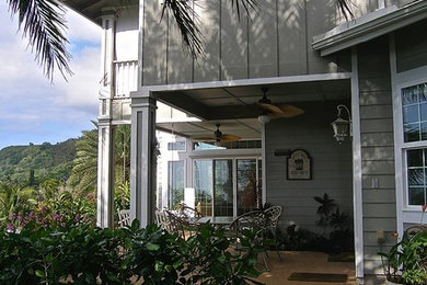 Photo of a large back patio in Hawaii with a roof extension.