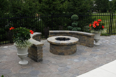 Small elegant backyard brick patio photo in Indianapolis with a fire pit