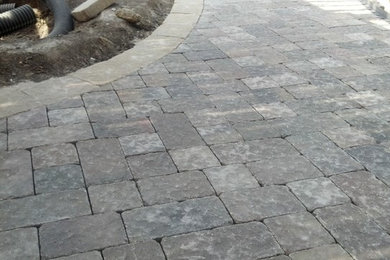 Patio - mid-sized rustic concrete paver patio idea in Omaha