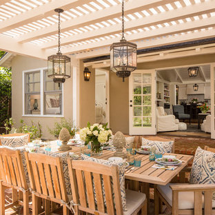 Inspiration for a timeless patio remodel in Los Angeles with a pergola