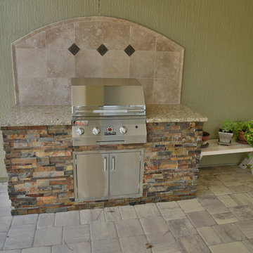 Pergola, privacy wall, outdoor kitchen.