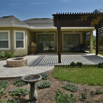 Pergola, privacy wall, outdoor kitchen.