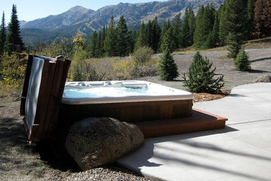 Patio fountain - traditional backyard concrete patio fountain idea in Denver with no cover