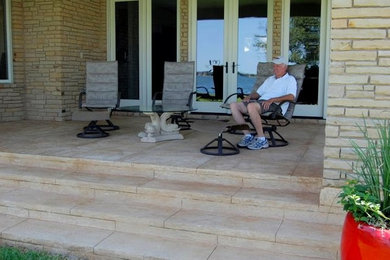 Patio - mid-sized mediterranean front yard patio idea in Austin with decking