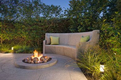 Example of a mid-sized classic backyard patio design in San Francisco with a fire pit and no cover