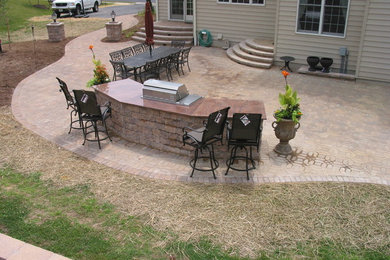 Patio kitchen - mid-sized traditional backyard concrete paver patio kitchen idea in Baltimore with no cover