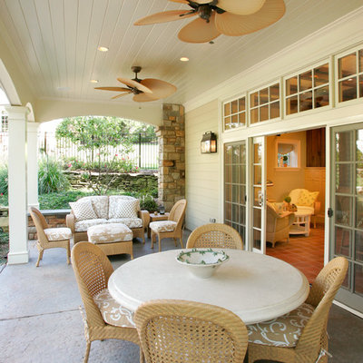 Example of a mid-sized classic patio design in Philadelphia with a roof extension