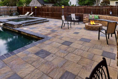 Patio - traditional backyard stone patio idea in Philadelphia with a fire pit and no cover