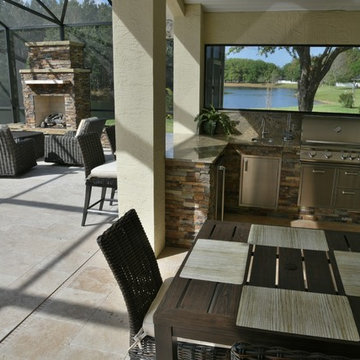 Poolside outdoor kitchen and gas fireplace