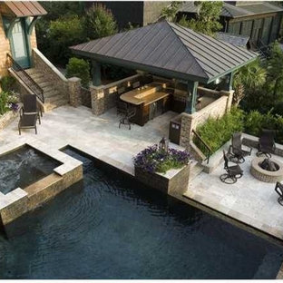 Patio kitchen - mid-sized traditional backyard stamped concrete patio kitchen idea in Tampa with a gazebo