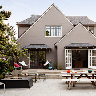Inspiration for a mid-sized contemporary backyard concrete paver patio remodel in Portland with a fire pit