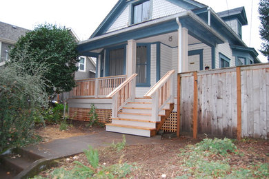 Patio - mid-sized craftsman front yard patio idea in Portland with decking and a roof extension