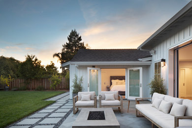 Example of a mid-sized farmhouse tile patio design in San Francisco with no cover
