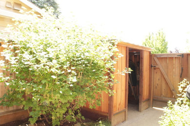 Example of a mid-sized arts and crafts side yard patio design in San Francisco with a roof extension
