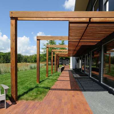 Inspiration for a contemporary patio remodel in Minneapolis with a pergola