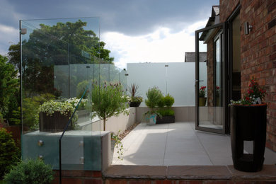 Photo of a contemporary patio in Manchester.