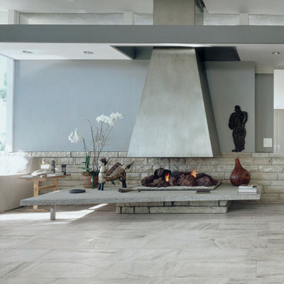 Large trendy tile patio photo in Orange County with a roof extension and a fireplace