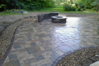 Inspiration for a medium sized traditional back patio in Boston with a fire feature, tiled flooring and no cover.