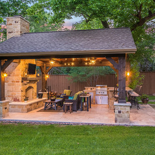 Inspiration for a mid-sized rustic backyard tile patio kitchen remodel in Houston with a gazebo