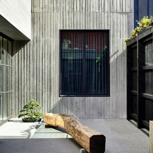 Modern courtyard patio in Los Angeles with tile and no cover.