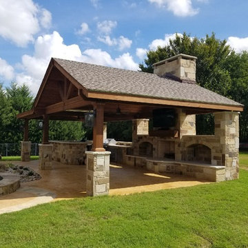 Prosper - Freestanding patio with outdoor kitchen, fireplace and firepit.