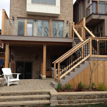 PVC deck with Tempered glass railings, Interlocking stone, and Basement Walkout