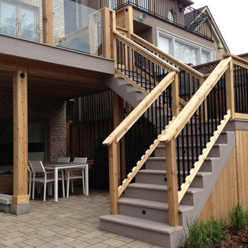PVC deck with Tempered glass railings, Interlocking stone, and Basement Walkout