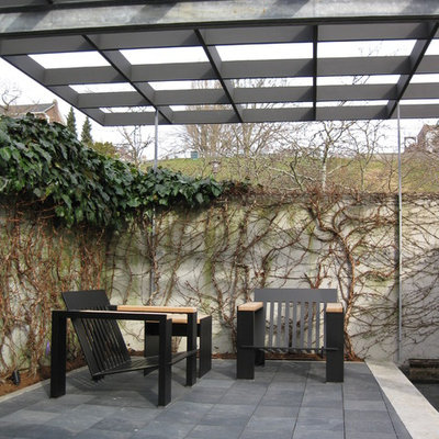 Minimalist patio photo in Seattle with a pergola