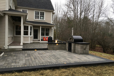 Patio kitchen - large contemporary backyard concrete paver patio kitchen idea in Portland Maine