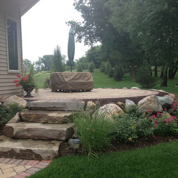 Raised Patio with Boulder Retaining Wall