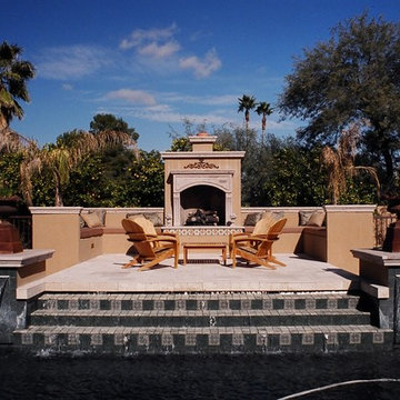 Raised poolside patio and fireplace