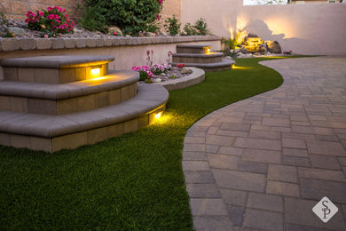 Mid-sized elegant backyard concrete paver patio container garden photo in Los Angeles