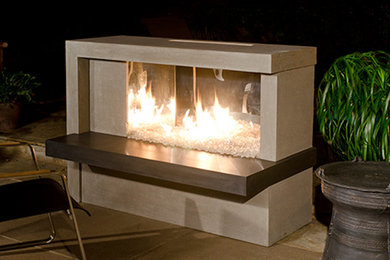 Example of a mid-sized trendy backyard tile patio design in Seattle with a fire pit and no cover