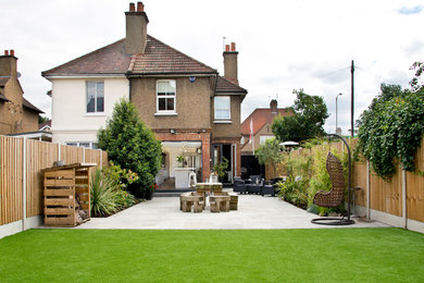 Photo of a contemporary back patio in Essex with a vegetable patch, concrete paving and no cover.