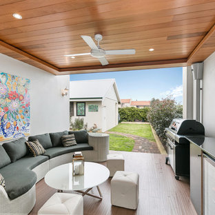 Design ideas for a transitional patio in Perth with a roof extension.