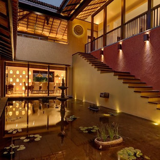 Esempio di un patio o portico etnico