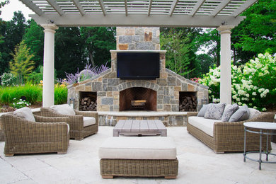 Inspiration for a large modern backyard stone patio remodel in New York with a fire pit and a pergola